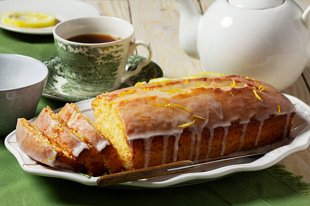 istock Aromatic lemon cake, covered with sugar icing and sprinkled with zest, served with tea. 2212793771