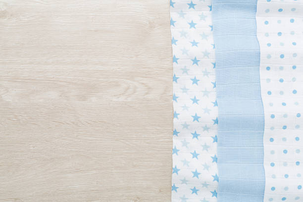 Cotton fabric on wooden background, top view