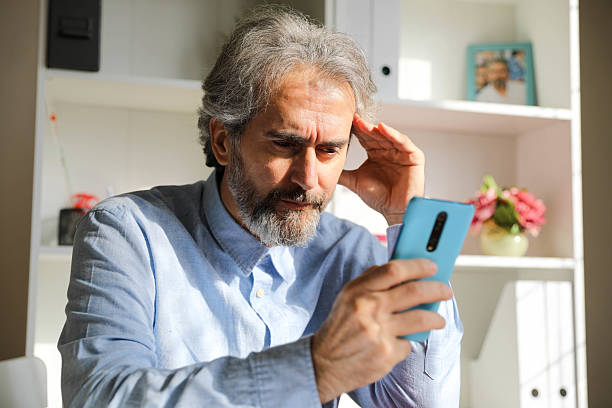 istock Senior man texting on smartphone indoors 2212796165