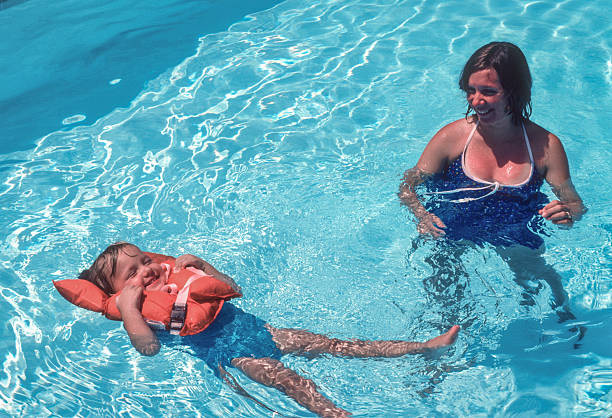 istock Naples - Mother & Daughter in Pool - 1981 2212802039