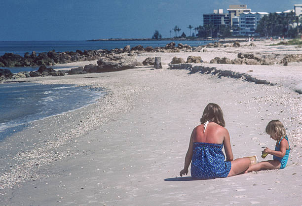 istock Naples - Mother & Child on Beach - 1981 2212802183