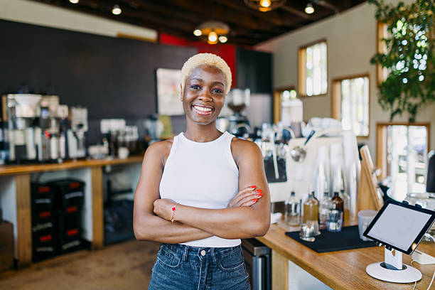 Cheerful Coffee Shop Owner At Work stock photo