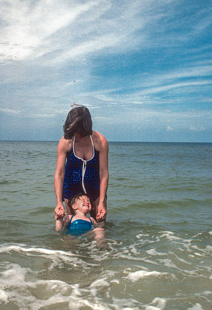 Naples - Mother & Daughter in Gulf Water - 1981. Scanned from Kodachrome 64 slide.