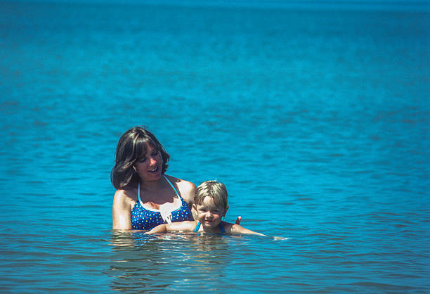 Naples - Mother & Child Swimming in the Gulf - 1981. Scanned from Kodachrome 64 slide.
