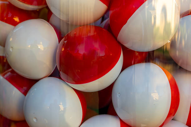 istock Vibrant collection of colorful beach balls on display, inviting summer fun and joyful memories beneath the warm sun 2212802425
