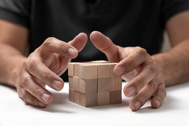 istock Business or career building concept using stack of blank wooden cubes on table 2212803984