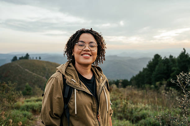 istock Adventurous young woman walking on mountain trail 2212808458