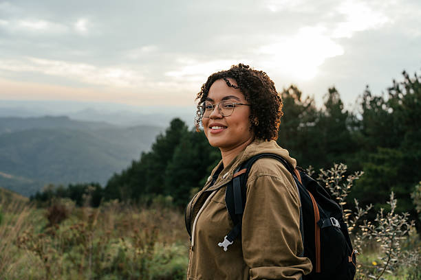 istock Adventurous young woman walking on mountain trail 2212808463