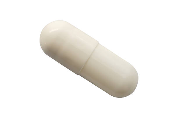 istock White medicine pill capsule isolated on white background 2212812383