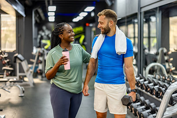 istock Two Friends Enjoying a Workout Session at a Modern Gym 2212814746
