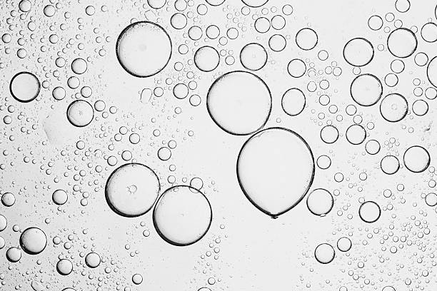 istock Texture, background, macro soda bubbles,Refreshing soda water with ice cubes against white background, closeup 2212818965