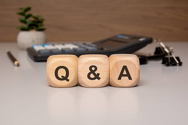istock Q and A Concept Wooden Blocks on Office Desk 2212820805