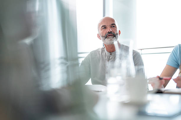 istock Senior Business Professional Engaging in Strategic Discussion 2212821206