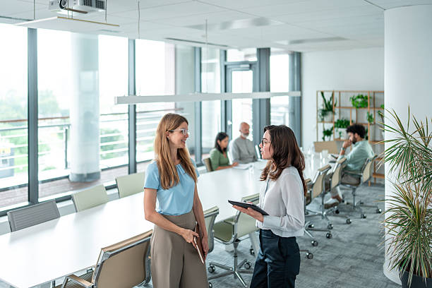 istock Professional Discussion Between Joyful Female Colleagues in Office 2212821225