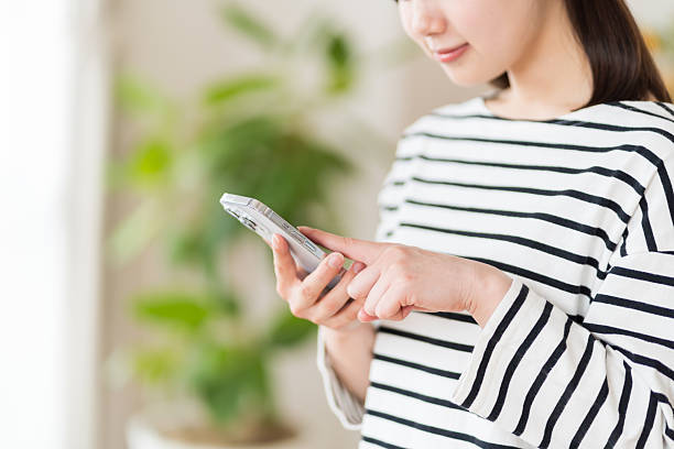istock A young woman operating a smartphone. 2212823140