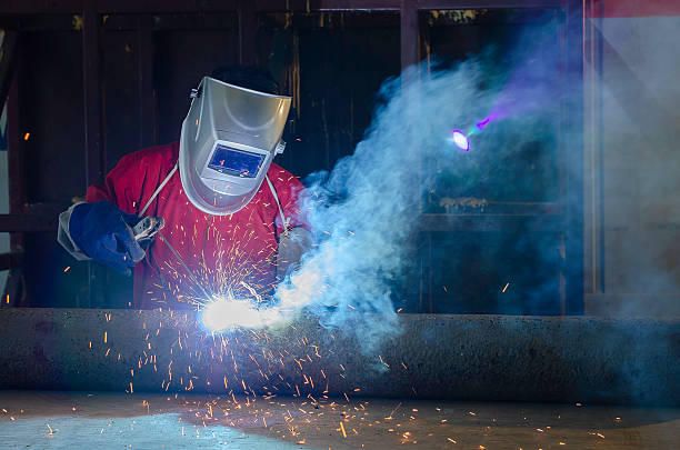 istock Close-up of welder working in workshop Pipe welding on the pipeline construction 2212827101