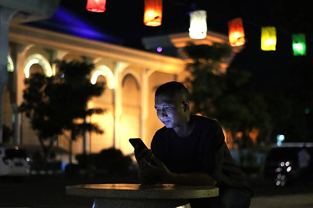 istock A man is texting with friends and arranging to meet up. 2212827965