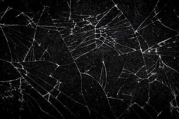 istock The pattern on the glass is cracked. damage to the glass.  cracked texture 2212834150
