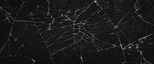 istock The pattern on the glass is cracked. damage to the glass.  cracked texture 2212834162