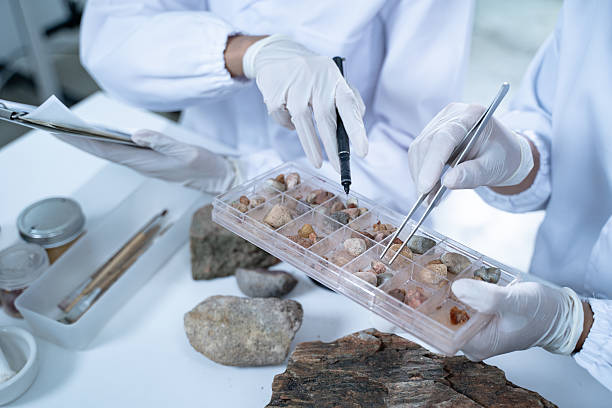 In the laboratory, research equipment rests on the table as scientists analyze rock samples, using advanced geology techniques to make groundbreaking discoveries in science.