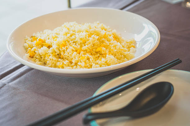 a plate of Egg Fried Rice served in a white porcelain plate
