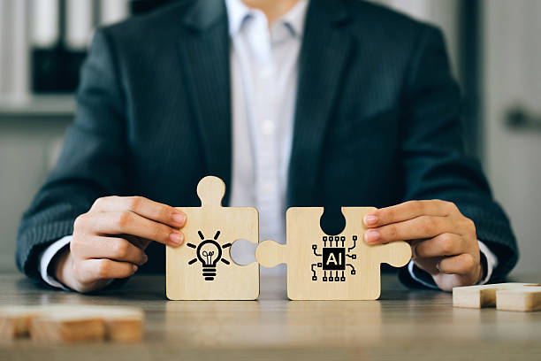 istock A businessman holding a jigsaw puzzle with a light bulb and AI connected. Using AI to generate business ideas. for new products or services, creative ideas, or content. AI adoption for business. 2212839504