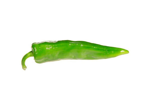 Fresh green chilies on white background