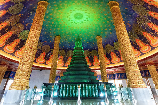 istock Green glass pagoda, Buddhist temple. Gold columns, artwork on the ceiling. 2212840603