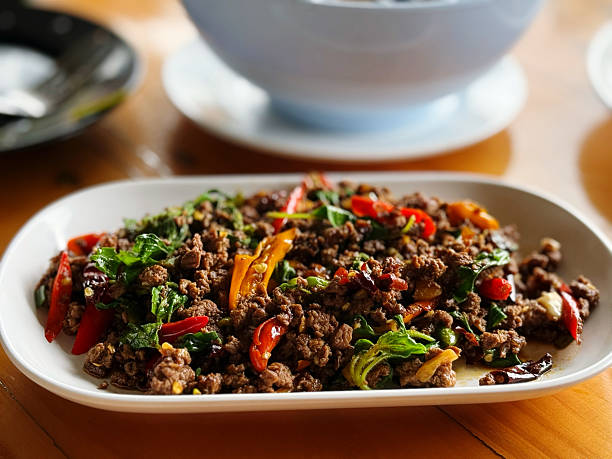 istock Stir-fried minced pork with basil and chilli on plate 2212840917