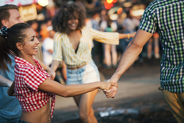 istock Friends dancing at a concert. 2212843487