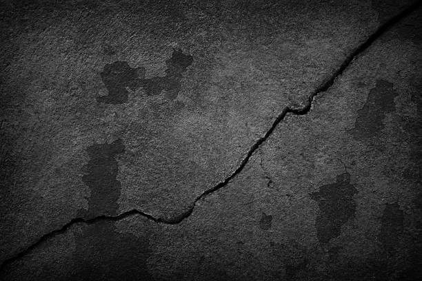 Crack old black background. Grunge texture. Dark wallpaper. Blackboard. Chalkboard
