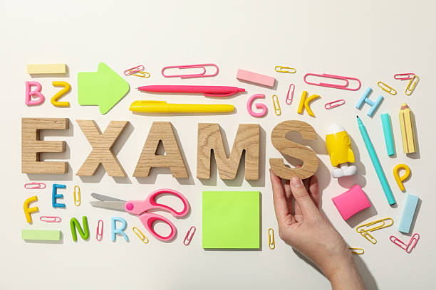 istock Exam, inscription on the table, on a light background. 2212844871
