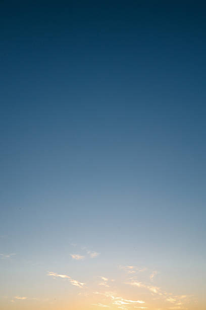 istock Clear gradient sky during sunset with soft golden and blue tones, minimal clouds and peaceful open atmosphere in nature 2212845691