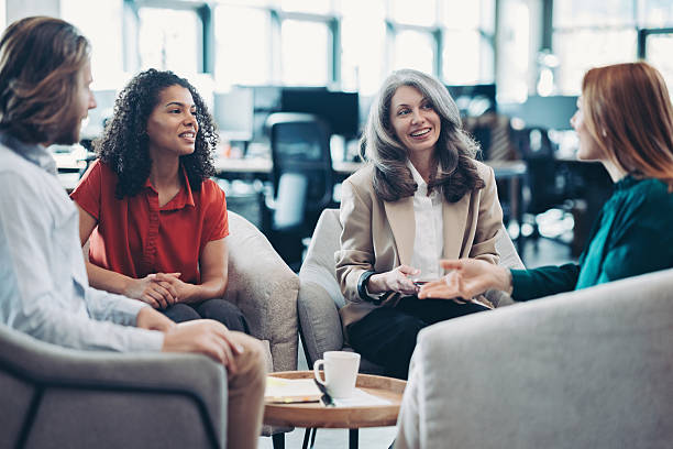 istock Business people sitting comfortably and talking 2212847361