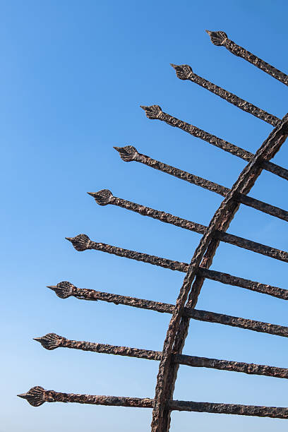 istock Rusty iron railing made in the shape of an arrow. Sharp-end iron bars. 2212848182