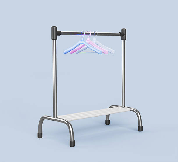 Clothing rack for hanging clothes with shoe shelf. Black silver stand with color hangers render. Empty home storage furniture for coat and wardrobe. Fashion store interior element Clothing rack for hanging clothes with shoe shelf. Black silver stand with color hangers render. Empty home storage furniture for coat and wardrobe. Fashion store interior element. 3D illustration clothes hanger rod stock pictures, royalty-free photos & images