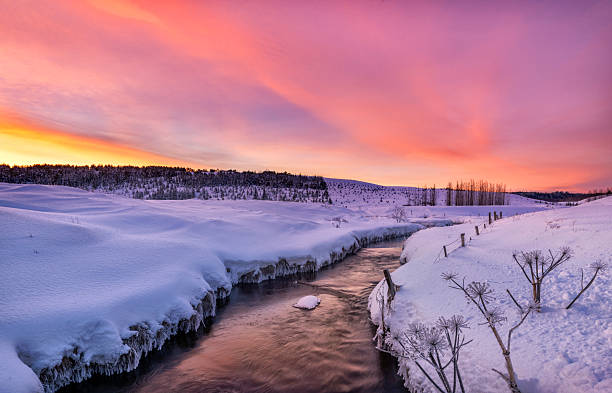 istock Beautiful winter sunset over the river 2212850845