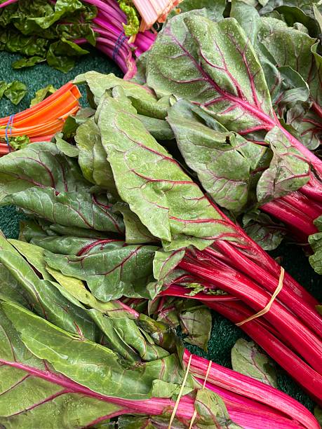 istock Freshly picked rainbow chard bunches at farmers market 2212853542