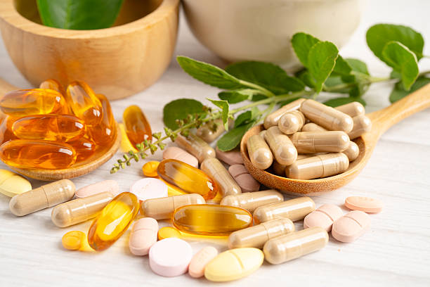 istock Alternative medicine herbal organic capsule drug herb. 2212855484