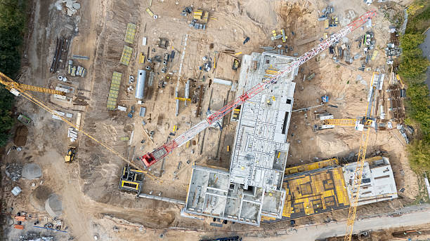 istock Aerial View of Construction Site with Cranes 2212856579