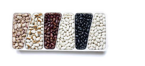 Assorted Dried Beans in a White Tray on a Clean White Background