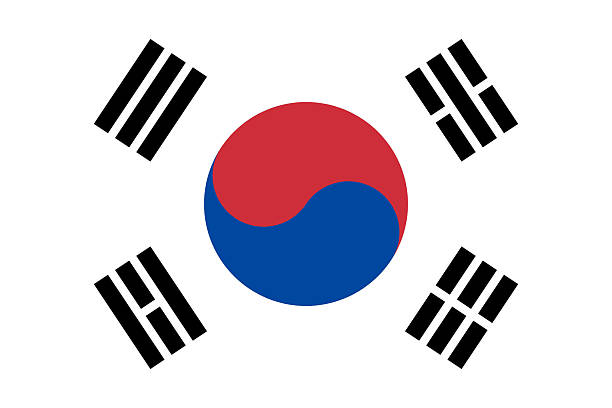 The image shows a digital illustration of the flag of South Korea, also known as the Taegukgi. This rectangular flag icon is depicted in its standard colors: white, red, blue, and black. Designed as a computer illustration, the flag features a red and blue yin-yang symbol centered on a white field, surrounded by four black trigrams, one in each corner. The design is presented in a clean and simplified layout that highlights its distinctive elements, making it suitable for various digital and graphic applications.