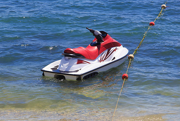 Jet ski on the water near the seashore close-up