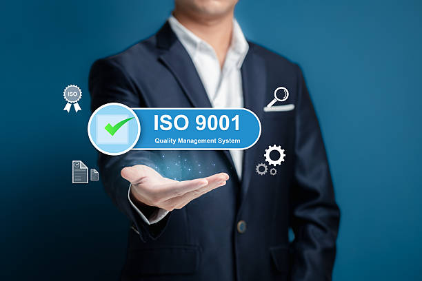istock Professional Businessman Displaying ISO 9001 Quality Management Concept 2212860501