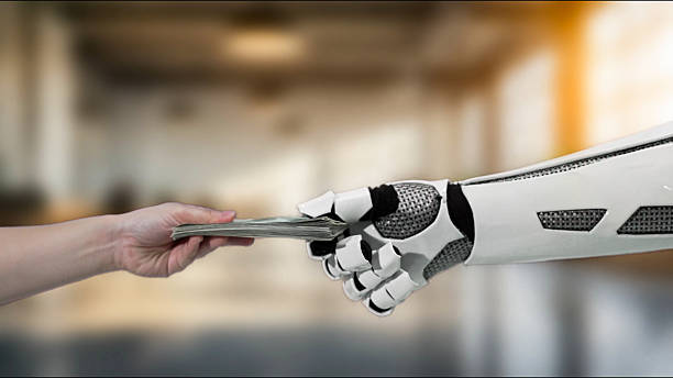istock Human hand exchanging cash with robotic hand symbolizing technology, finance, and the future of transactions in a modern digital economy 2212860571