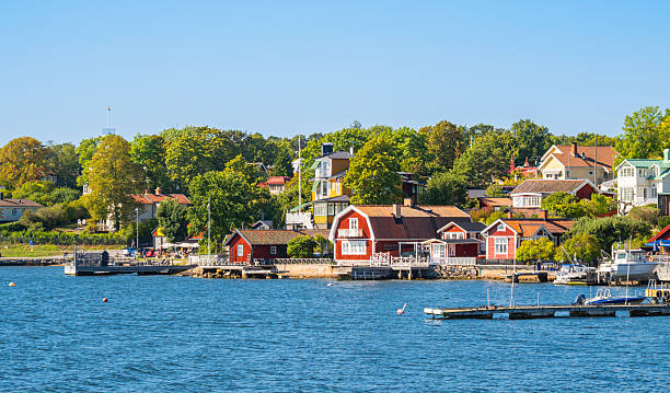 istock Colorful lakeside houses with lush greenery 2212861166