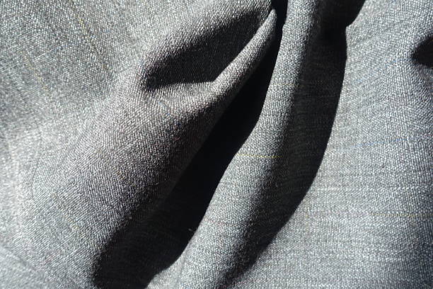 istock Soft folds on salt and pepper polyester fabric 2212861283