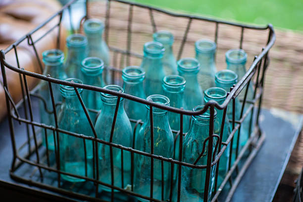 Vintage Glass Bottles in Wire Basket