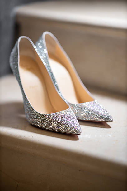 istock Elegant wedding shoes on marble stairs 2212866861