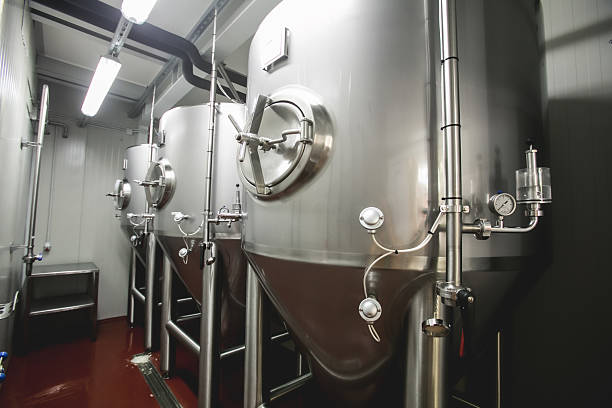 istock Stainless steel fermentation tanks in a modern brewery 2212866881